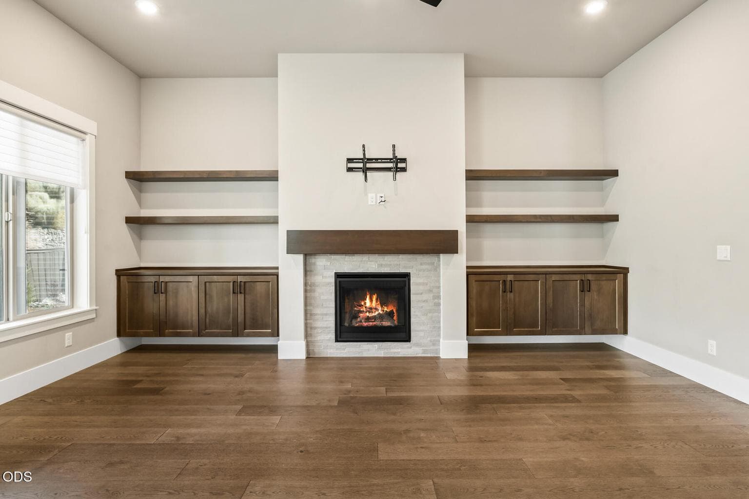 Great room with bult-ins, gas fireplace, and vaulted ceilings.