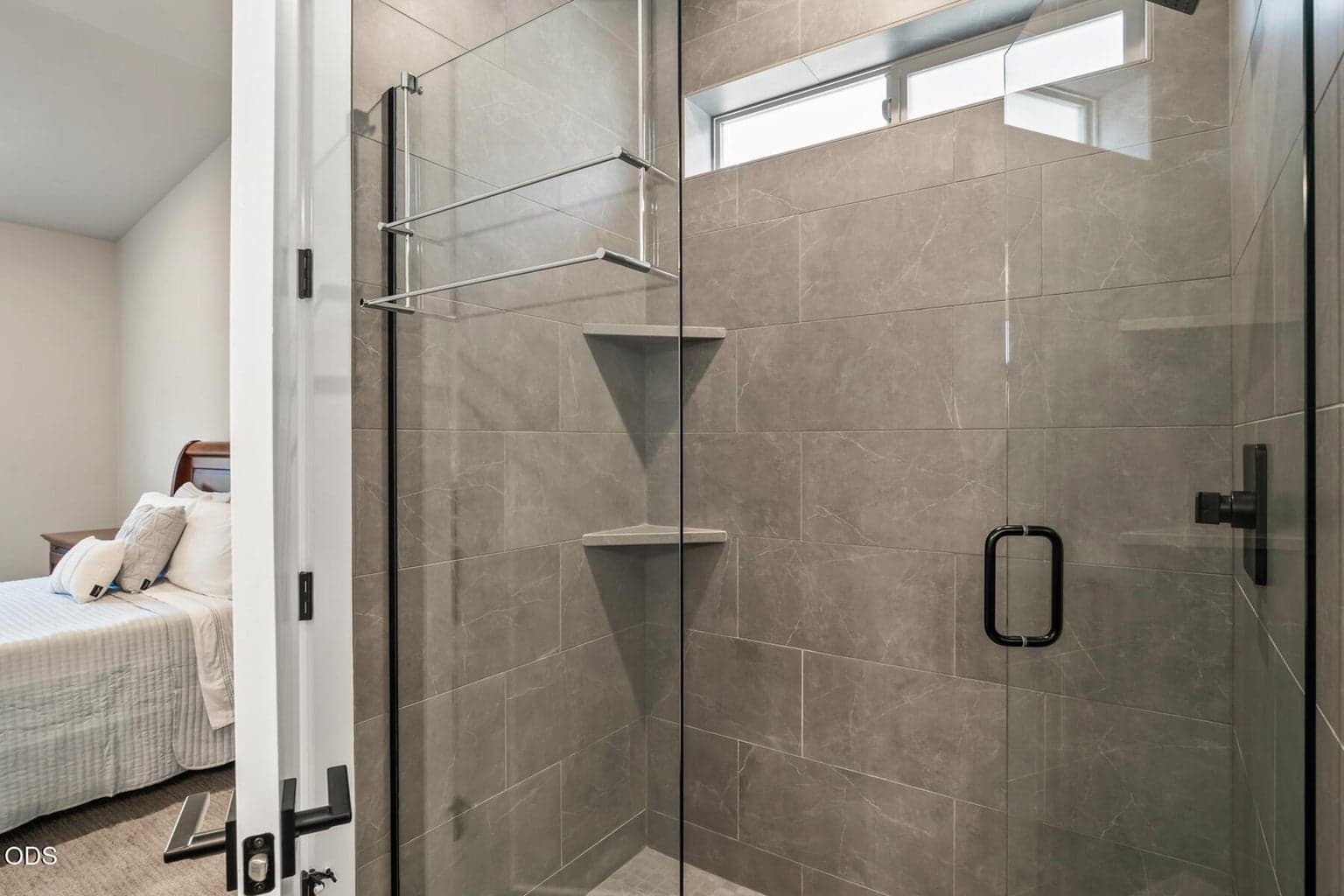 Primary walk-in, tiled, shower.
