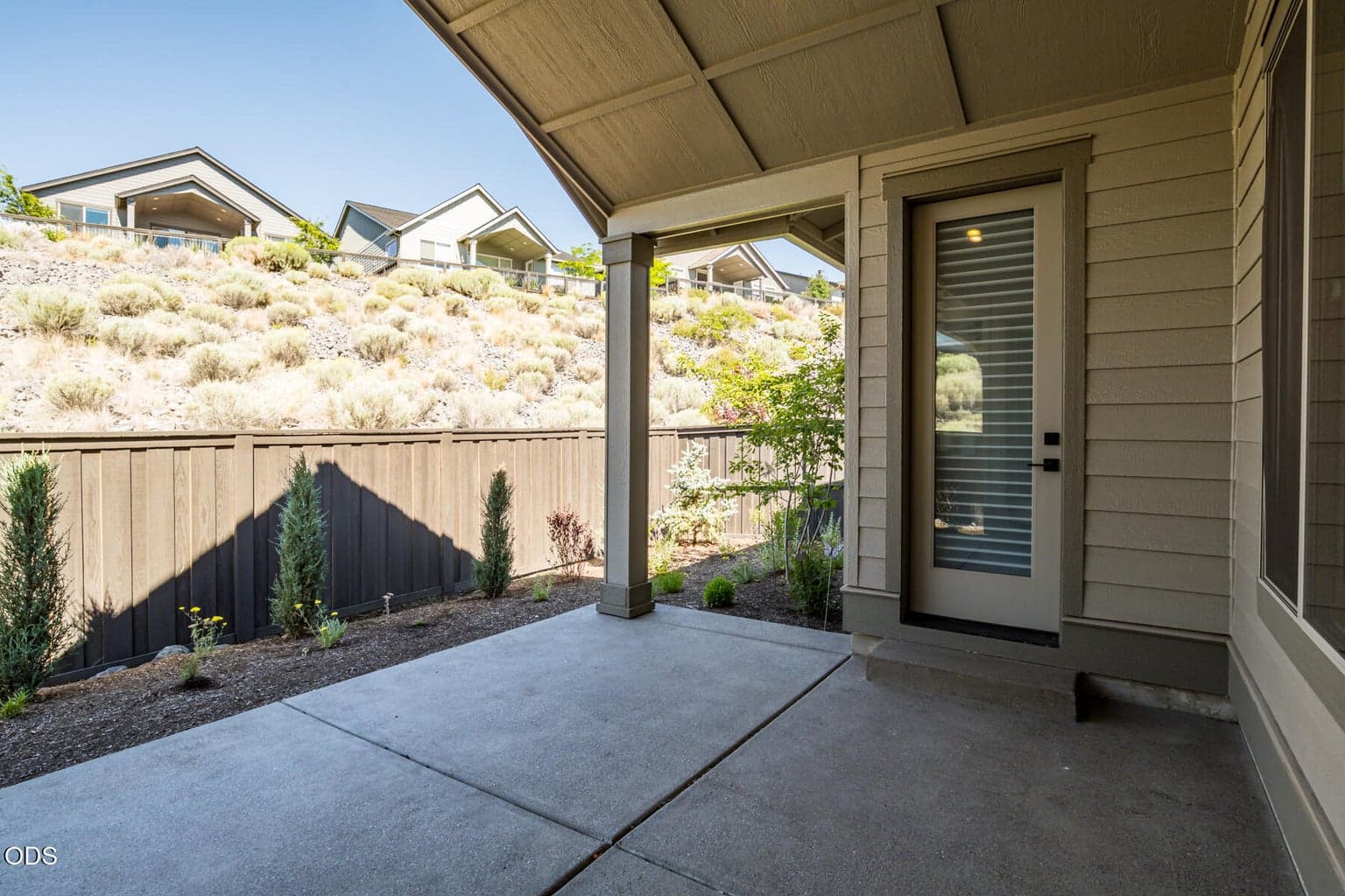 Covered back patio. Access from primary and dining.