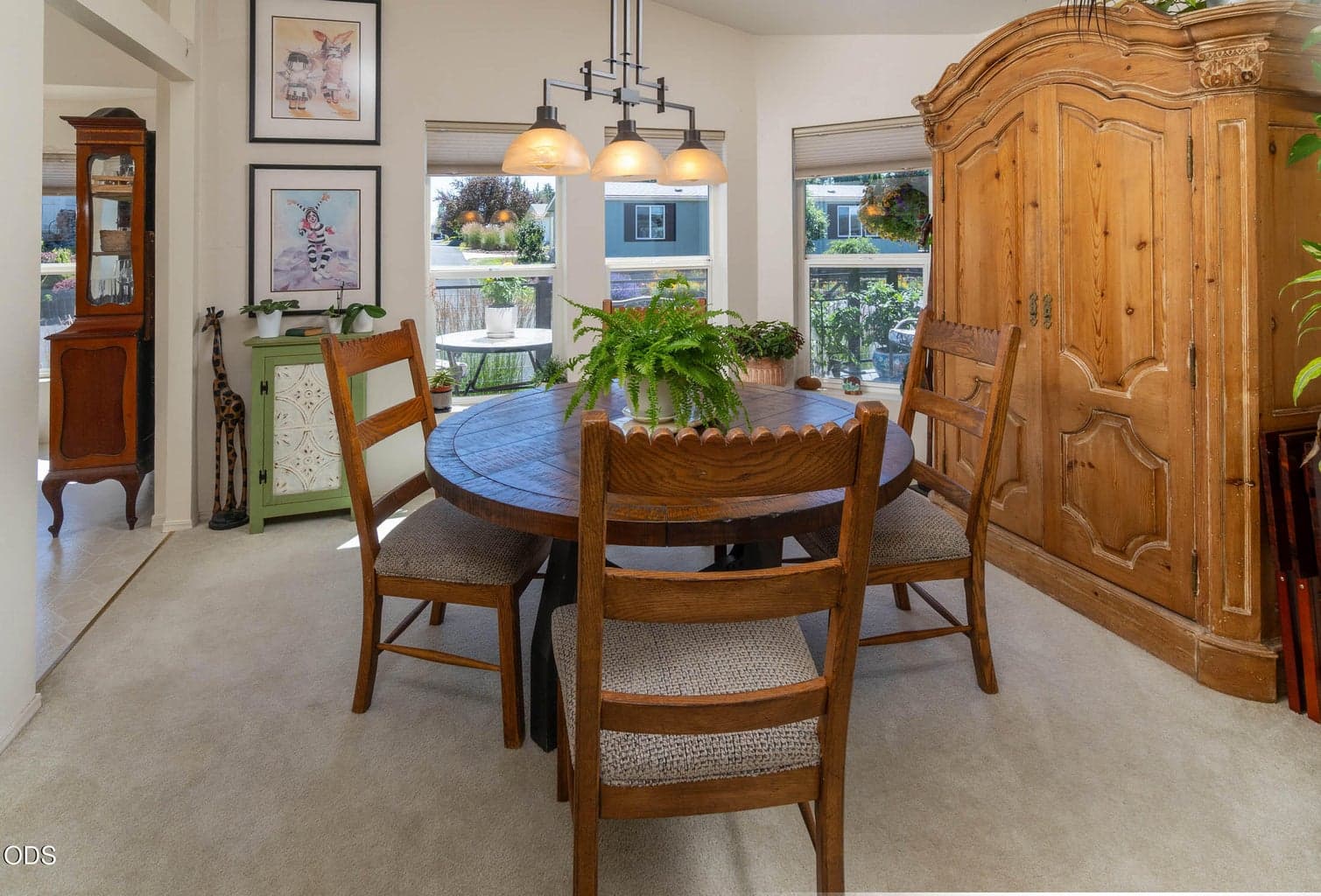 Dining area with large bowed windows. Great for entertaining, or family games.