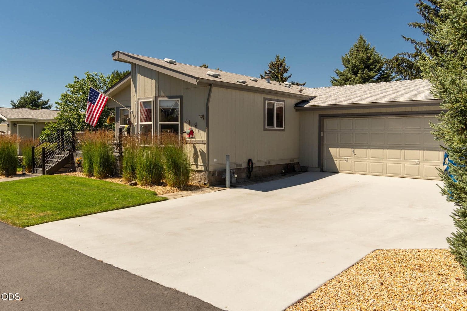 Ample parking for guests. This driveway has a custom finish, extra attractive.