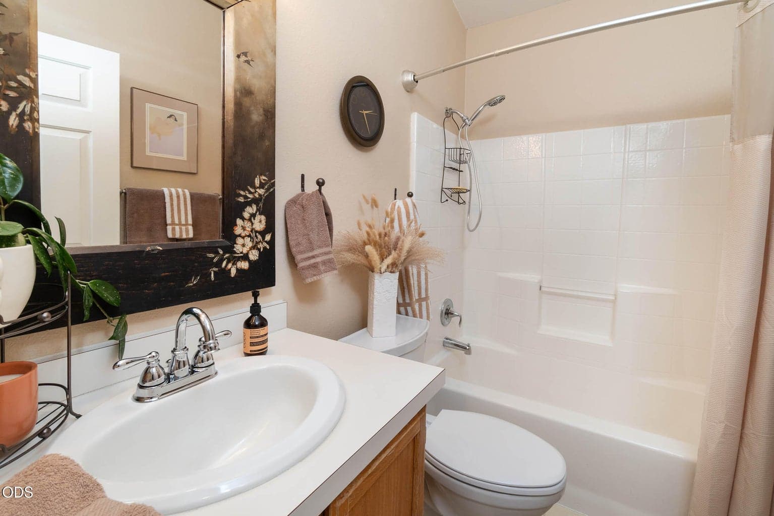 Guest bath complete with full tub and shower.