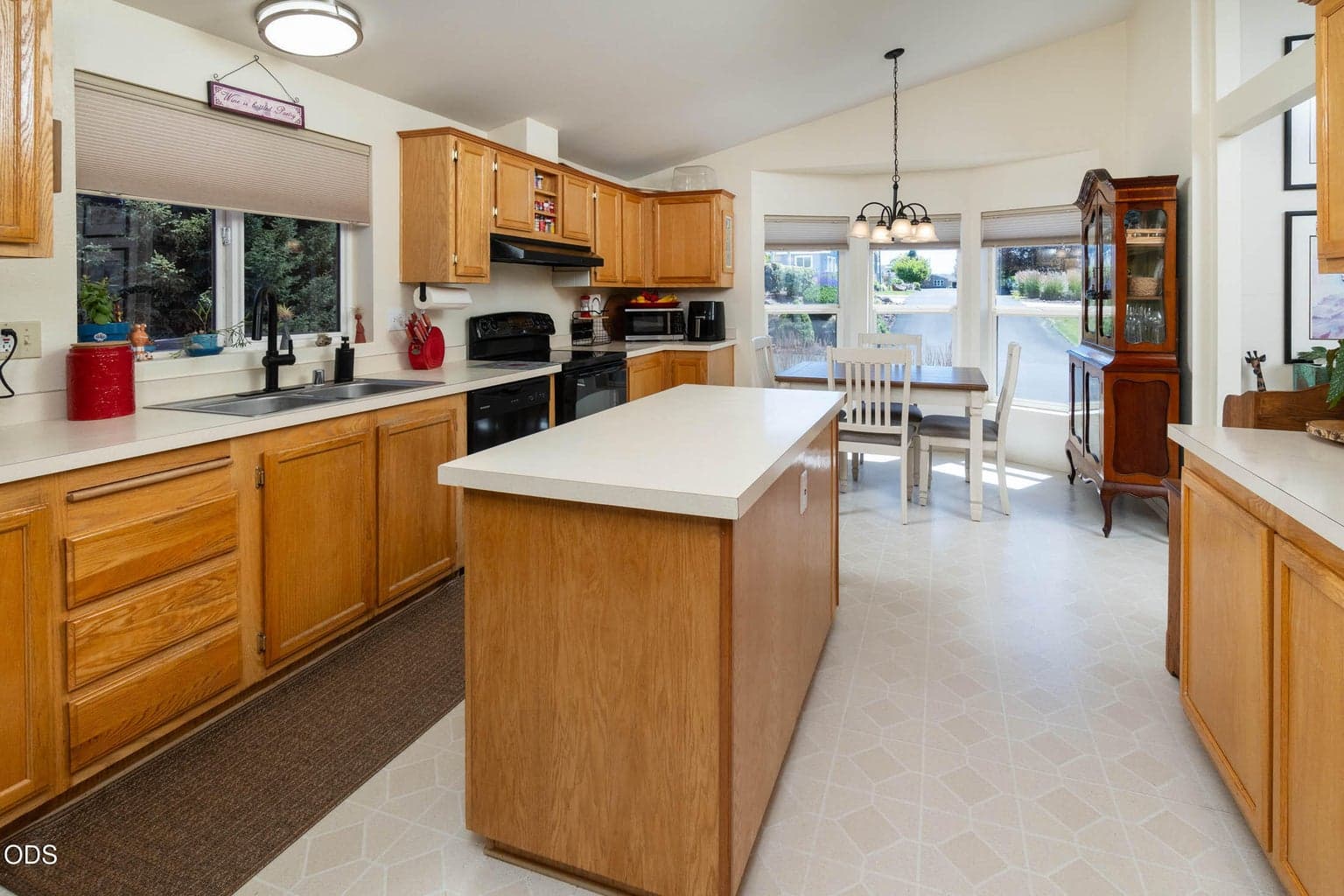 Island kitchen provides wonderful counter space, and perfect for entertaining. The breakfast area with large windows is sunny and inviting in winter.