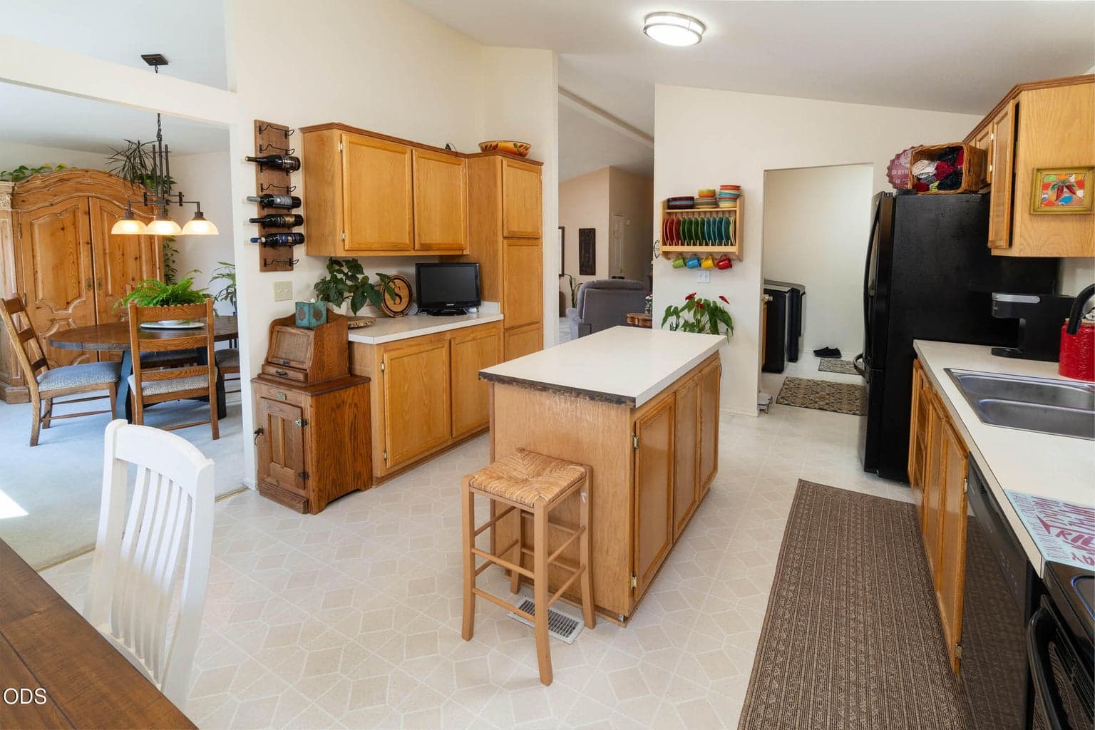 Tons of storage including kitchen pantry, extra cabinets and handy broom closet in the utility room. (Kitchen is plumbed for a gas range, if desired.)