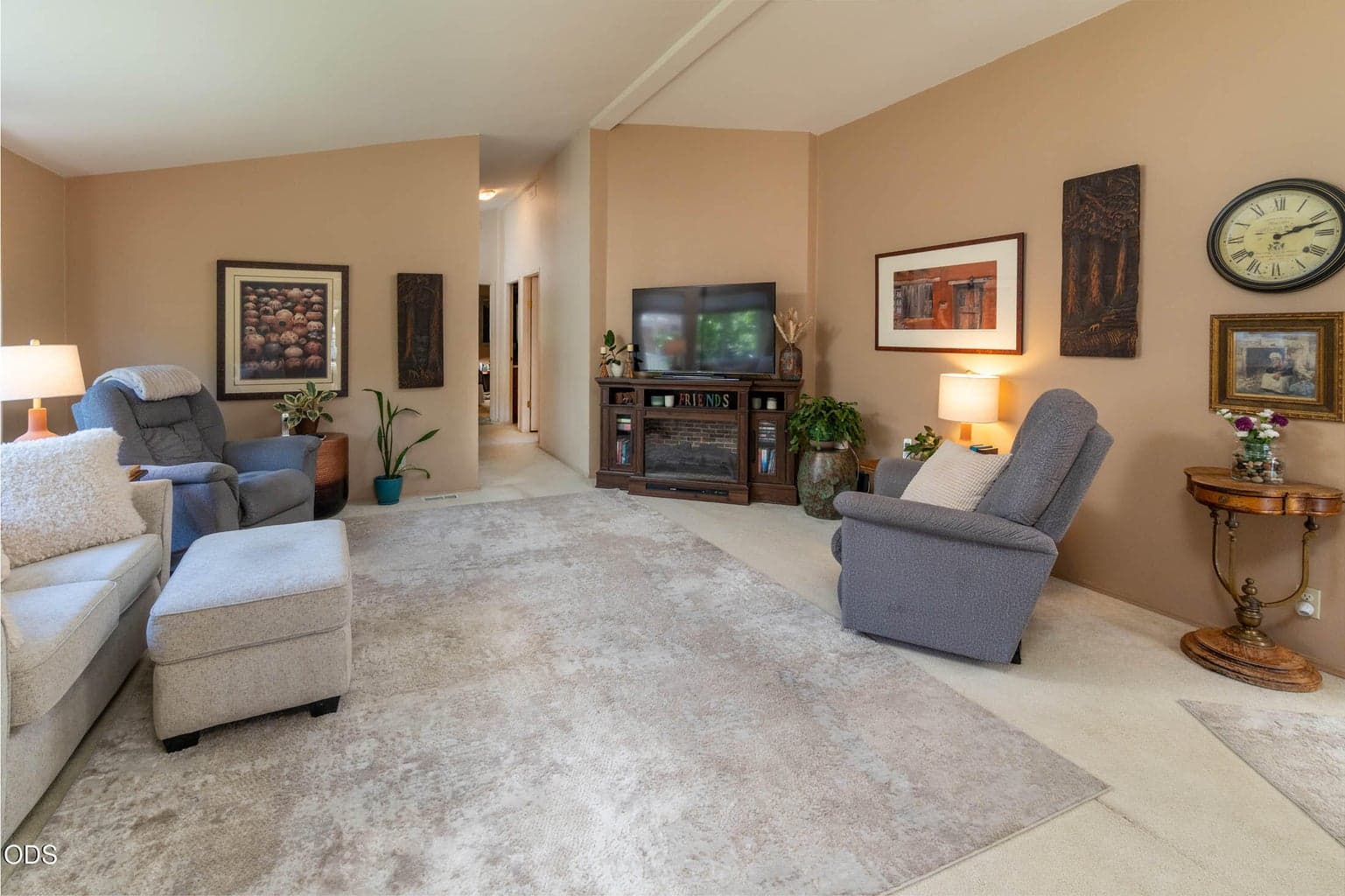 Sizeable vaulted living area. Not shown are the newer custom window shades, and updated light fixtures.