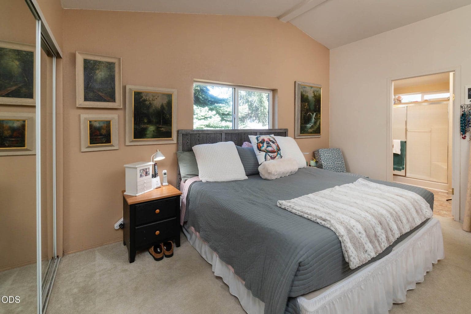 Primary suite, vaulted ceilings continue throughout. Nice closet space, and attached bath.