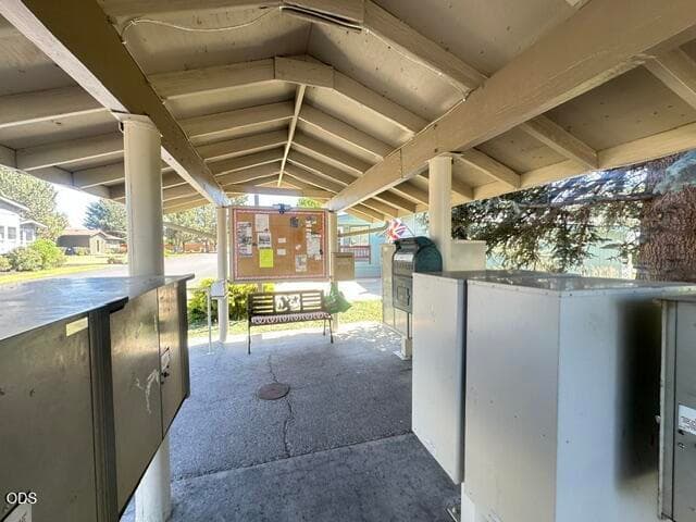 Covered mail area to pick up or send out mail. Handy spot to meet neighbors and read the bulletin board.
