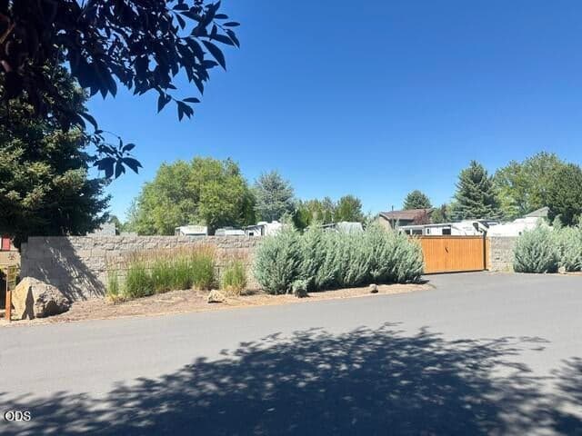 The entry to the RV Storage lot is just a couple of lots away. The storage area is a solid fence, and gated. There is a small fee for the RV parking area if space available.