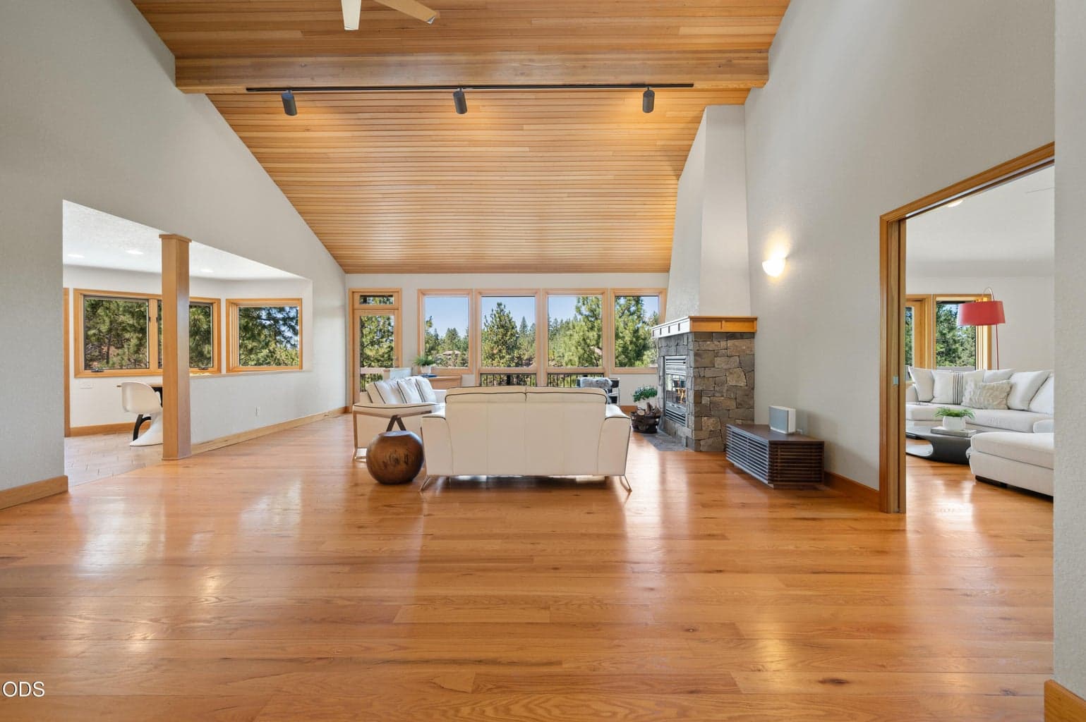 Expansive Great Room welcomes you in featuring warm wood accents, tons of natural light, and endless views.