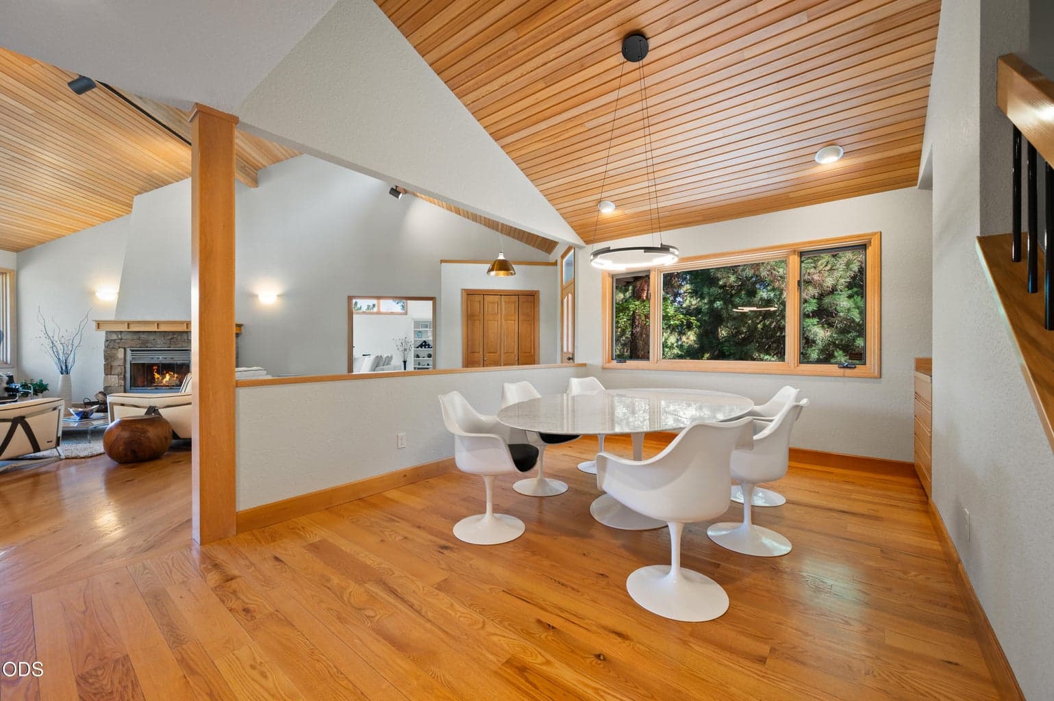 A beautiful space to entertain with built-in cabinetry and plenty of room looking out to the mature foliage.