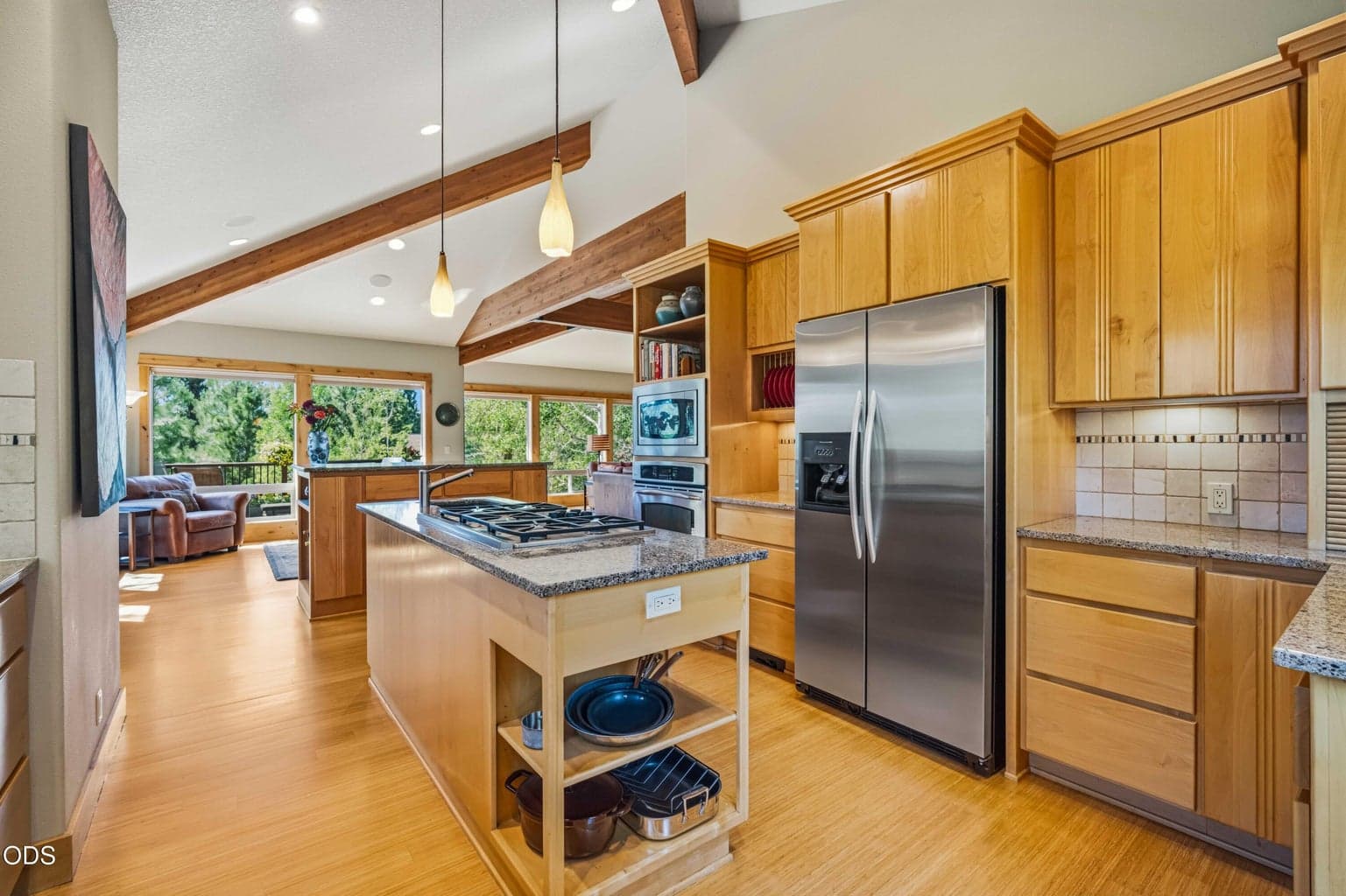 Floor-to-ceiling cabinetry, built-in stainless appliances and additional counter space provide substantial kitchen storage suited to a large home designed for comfortable full-time living.