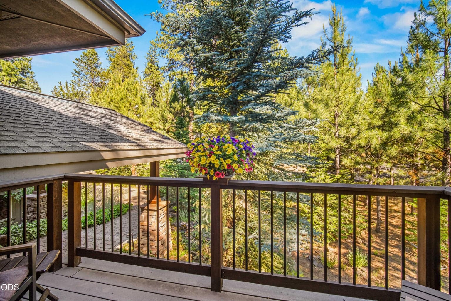 Just outside the kitchen, this elevated deck provides convenient outdoor access and a peaceful outlook through mature pines and aspens. It is well suited for morning coffee, grilling or stepping outside while cooking and entertaining.
