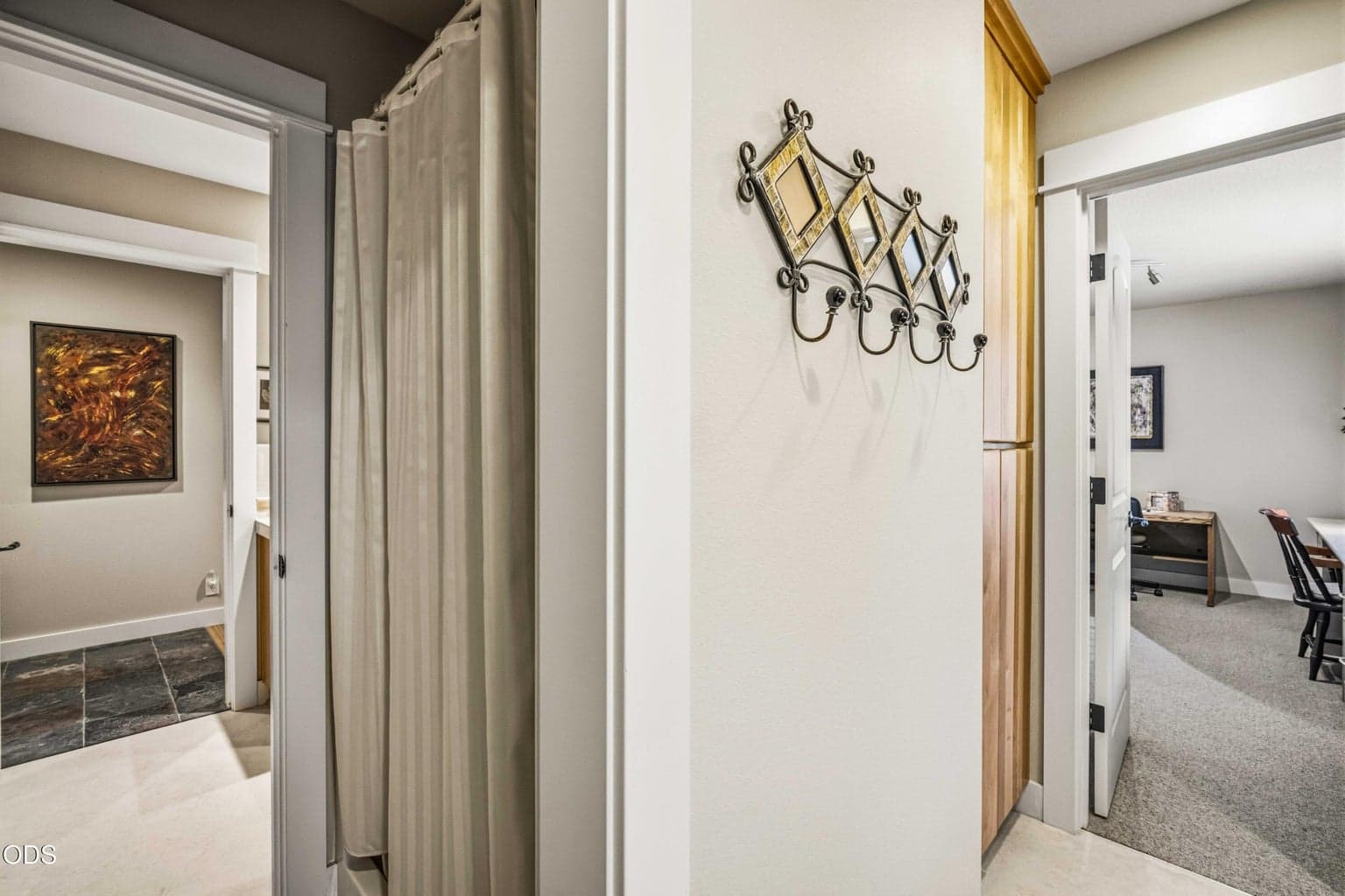 The central shower is shared between the bedroom’s private vanity and toilet area and a separate hall-side vanity and toilet room. This thoughtful Jack-and-Jill arrangement allows both spaces to retain privacy while sharing only the bathing area.