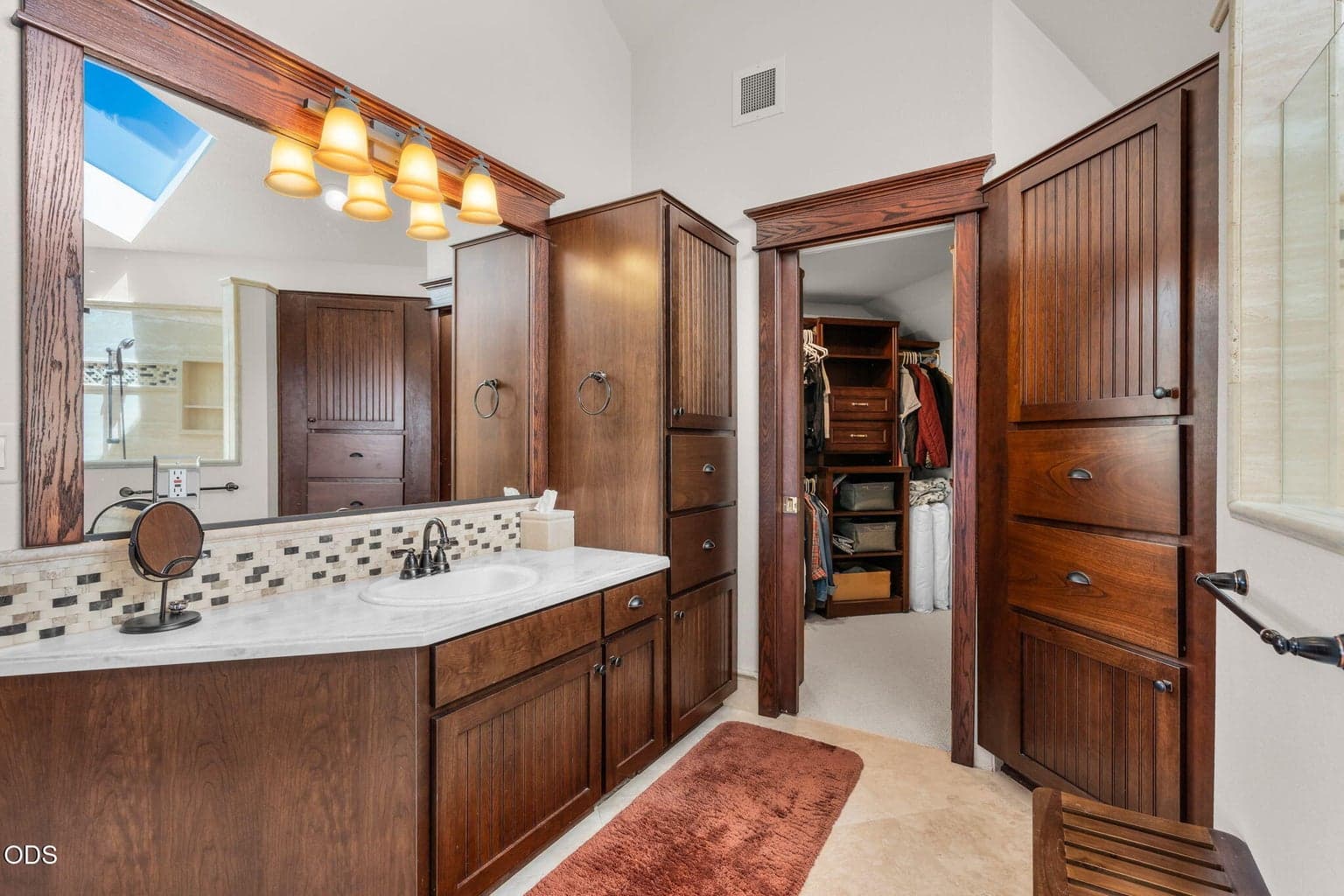 Tile floors and walk in closet. Same gorgeous wood interior throughout the home.