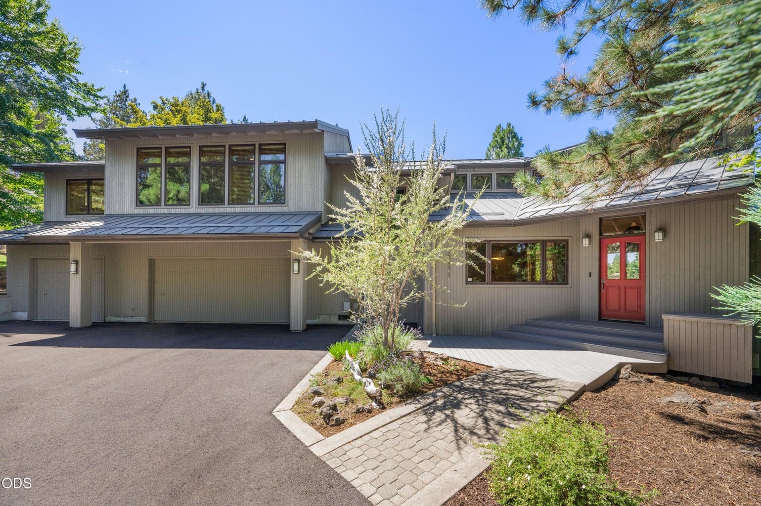 Timeless NW Contemporary design with lush landscaping and beautiful curb appeal.