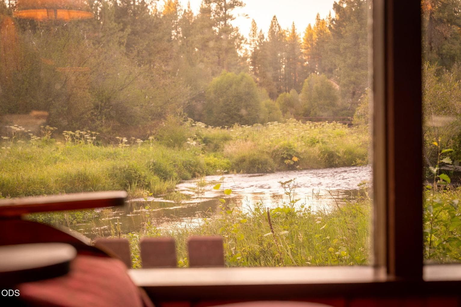 Looking through cabin living room windows.