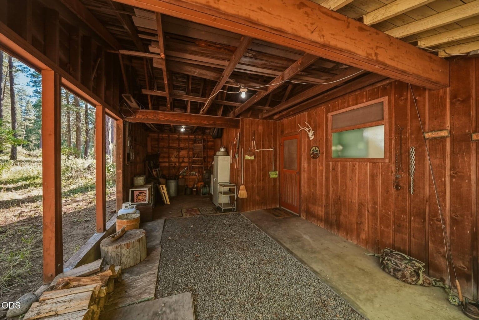 Carport attached to main cabin.