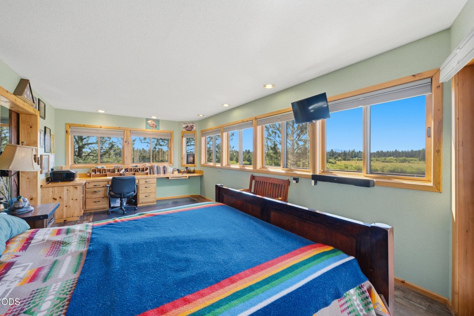 Primary Bedroom... Views of vast pasture down to the river, Mt. Bachelor and Cascades