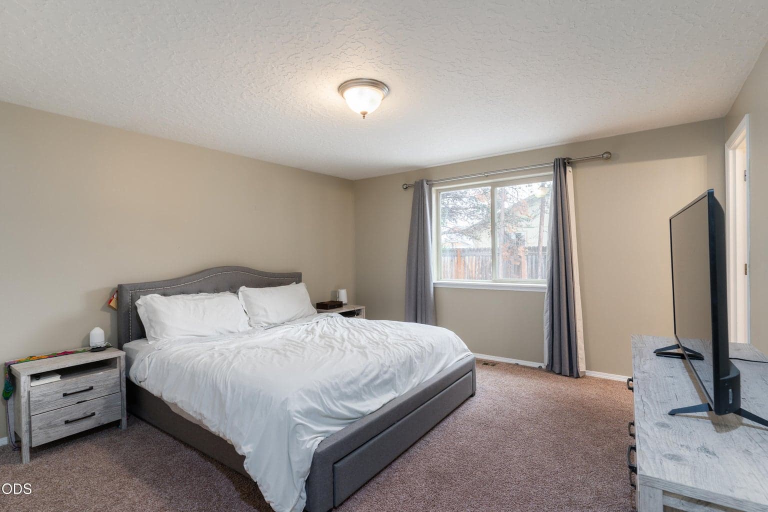 Primary suite with view of backyard.