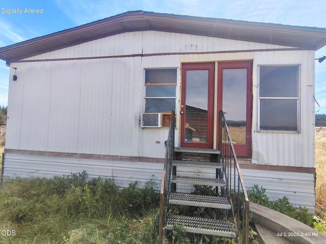Side of manufactured home with entrance