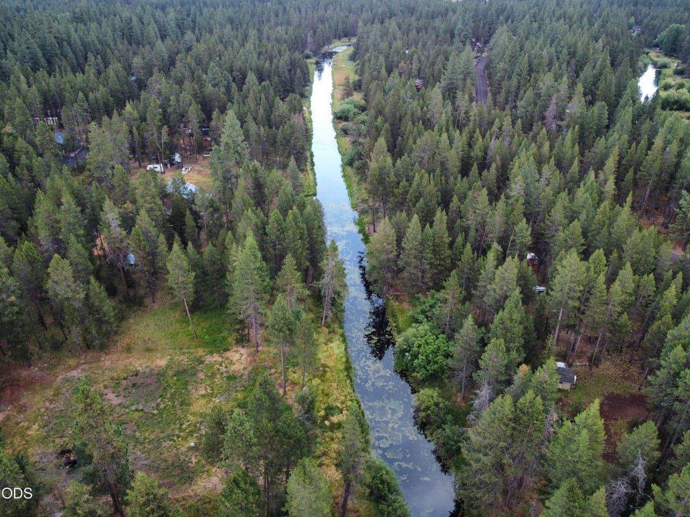 Island loop canal with a sliver of the connected Deschutes River visible