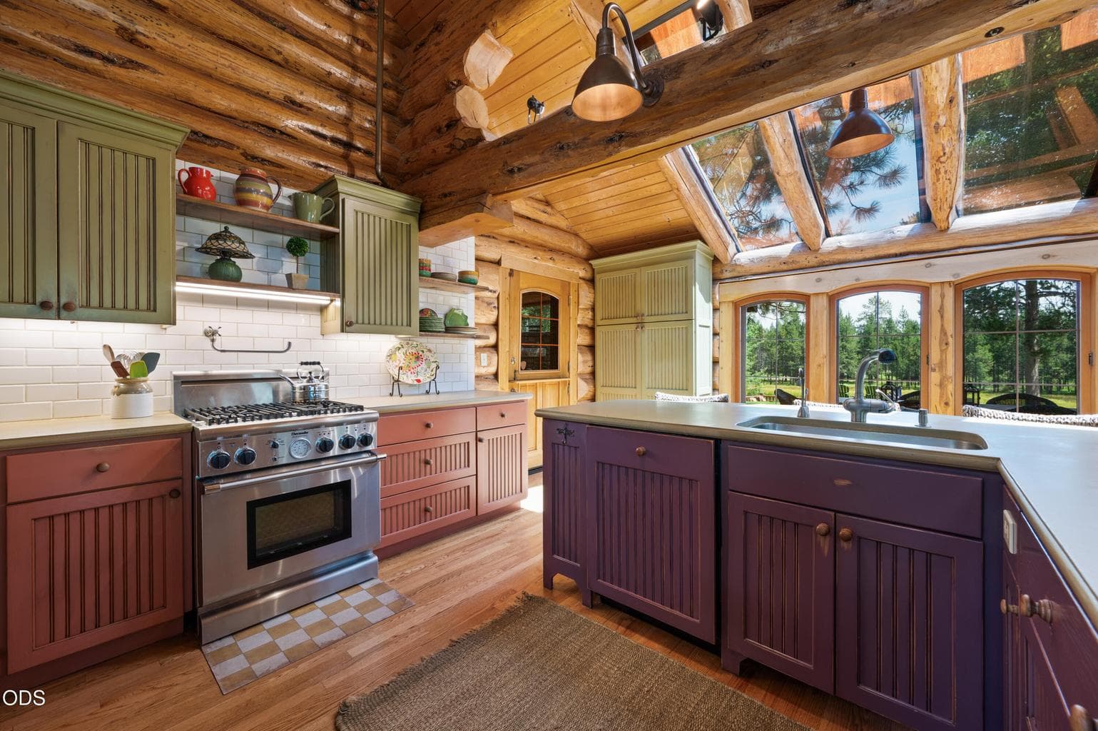 Solid surface countertops, subway tile backsplash, stainless appliances, and casual dining options.