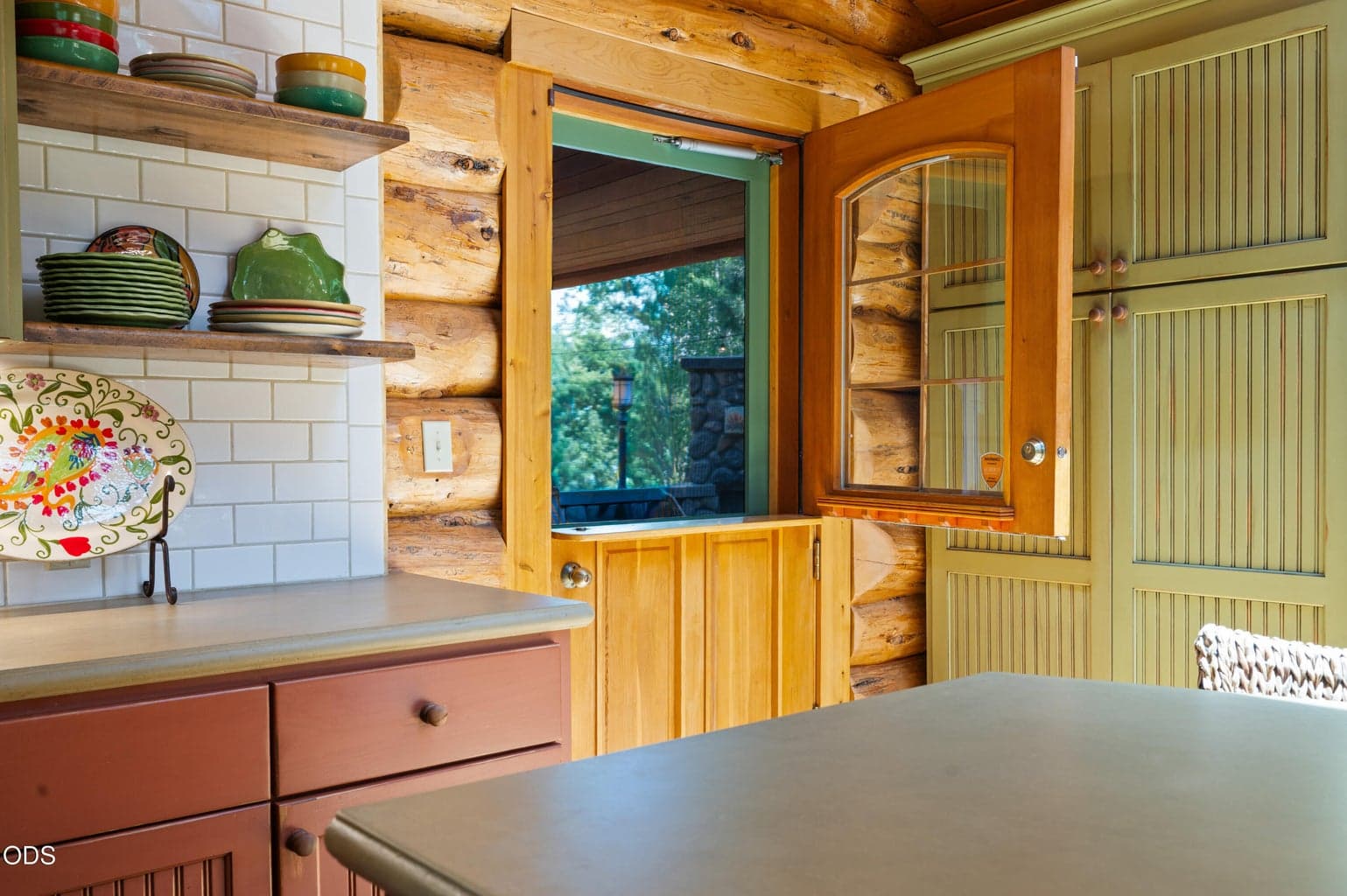 The charming Dutch door leads to the cozy, covered back porch.