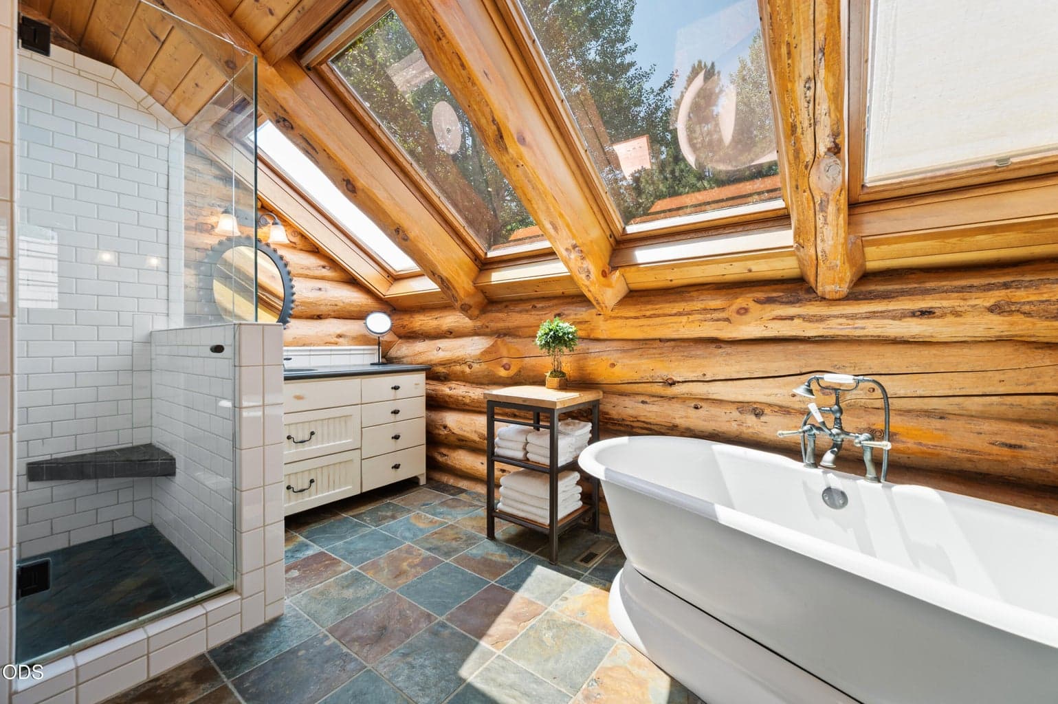 The light-filled Primary Bath features 2 separate vanities, soaking tub and tile shower.