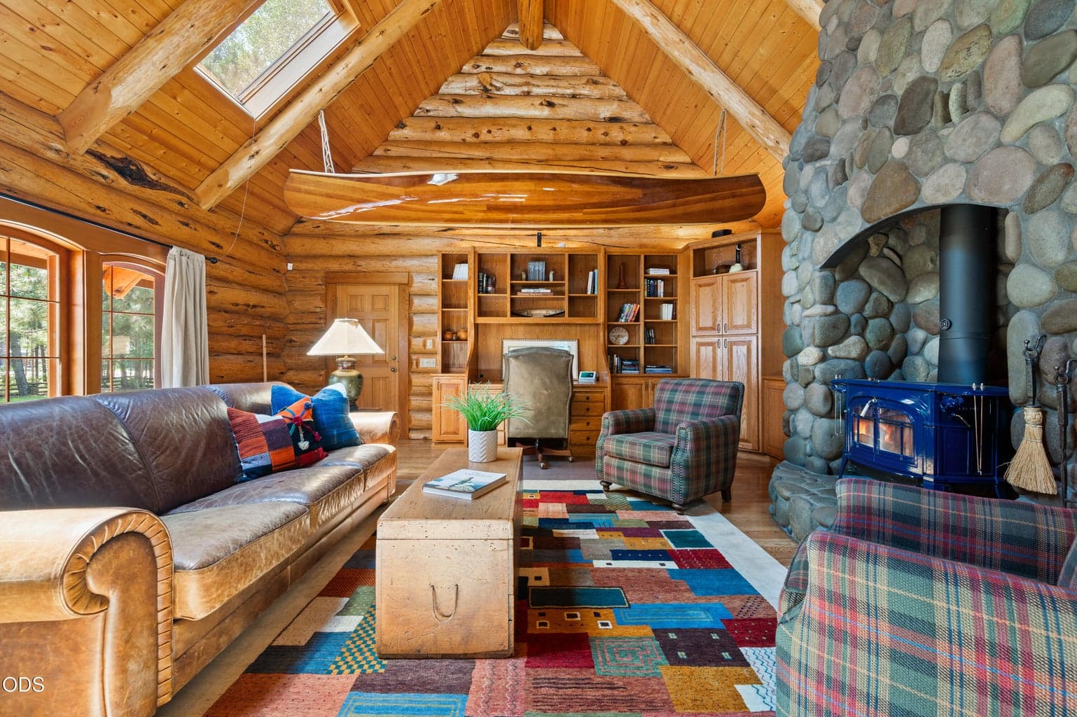 The "Canoe Room" creates additional private guest space with built-ins and a sofa sleeper.