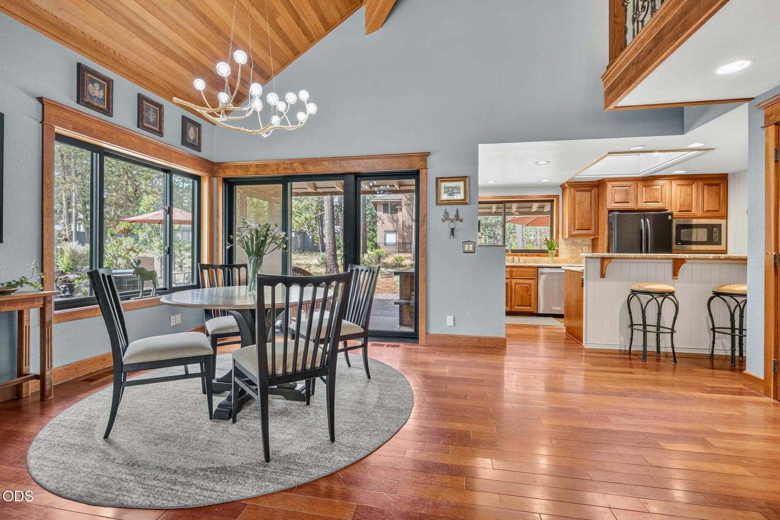 Vaulted clear cedar ceilings and expansive windows create a seamless indoor/outdoor living flow.