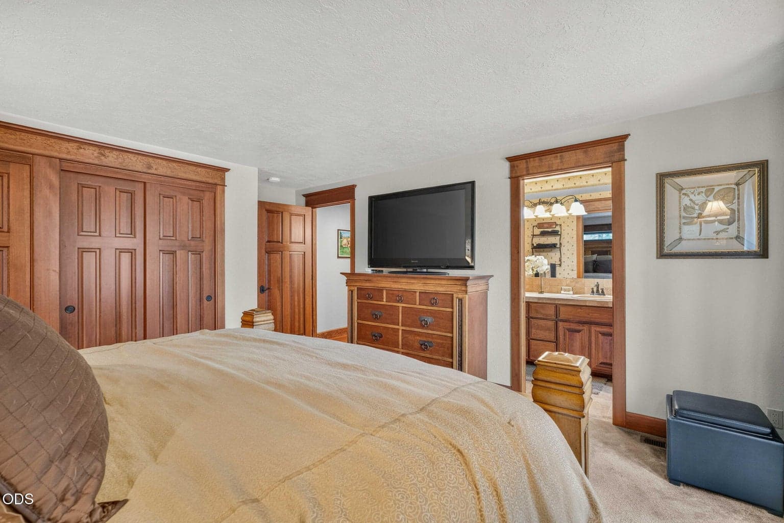 Primary suite with ensuite bath and inviting resort style comfort.
