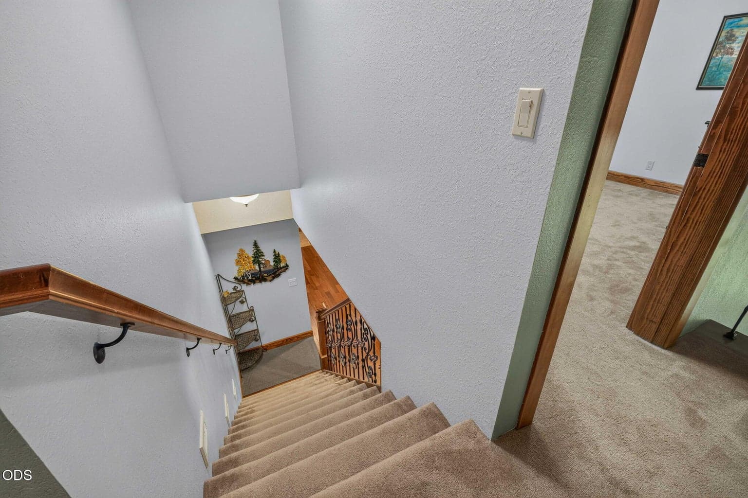 View from upper level shows stairway and the landing below.