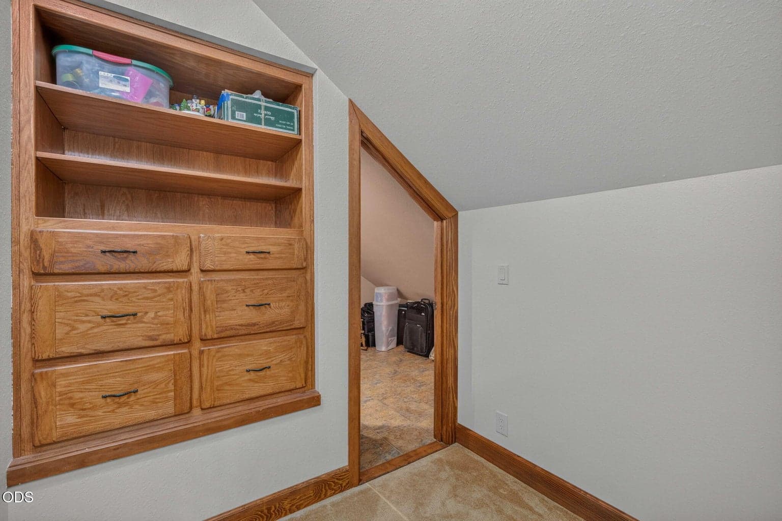 Built in drawers and shelving maximize storage in this custom closet.