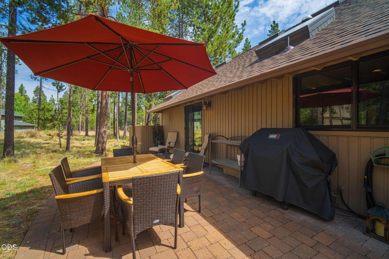 Expansive paver patio -ideal for outdoor dining and gatherings.