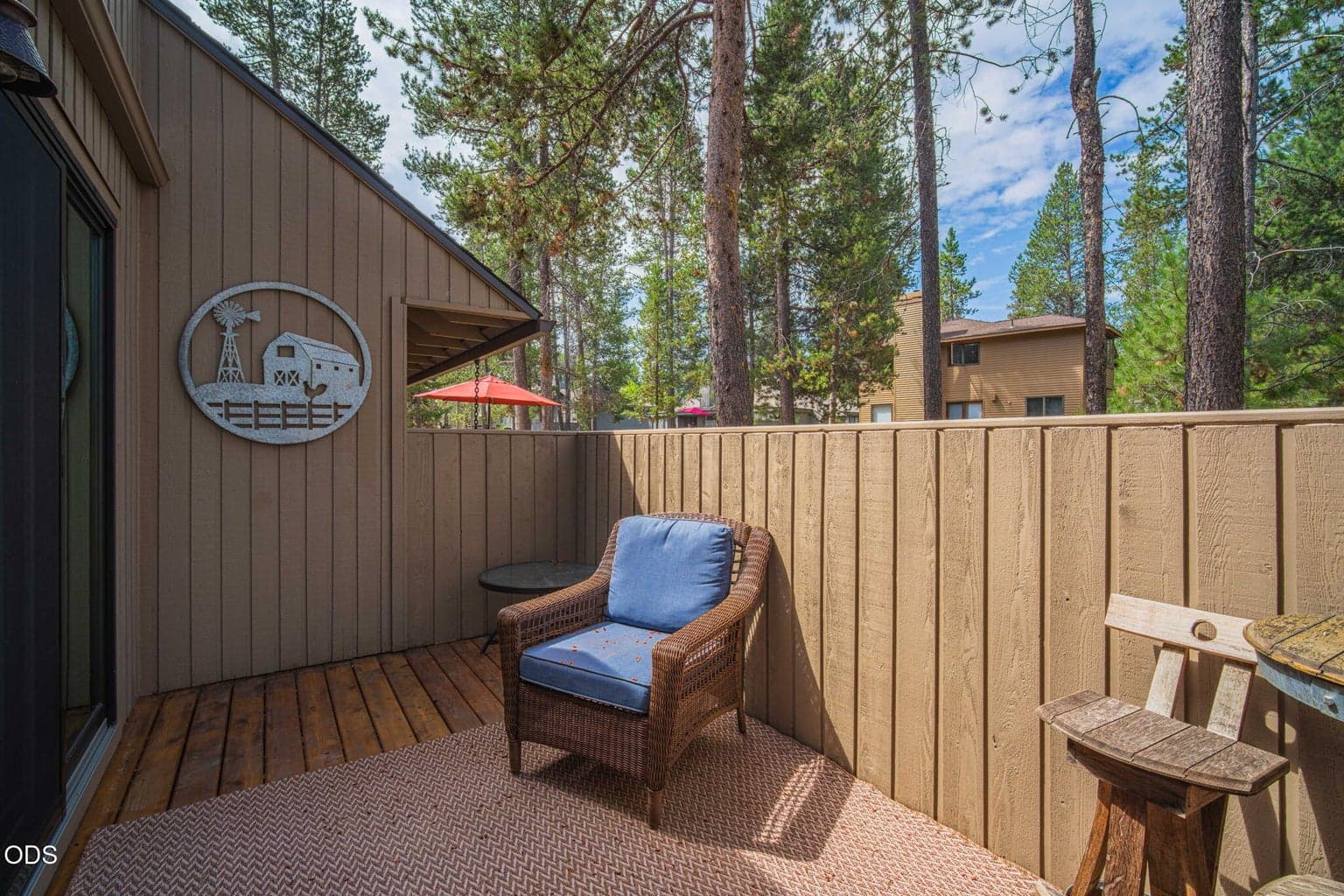 Enclosed deck off the main level primary suite - enjoy your coffee in privacy and comfort under the sun.