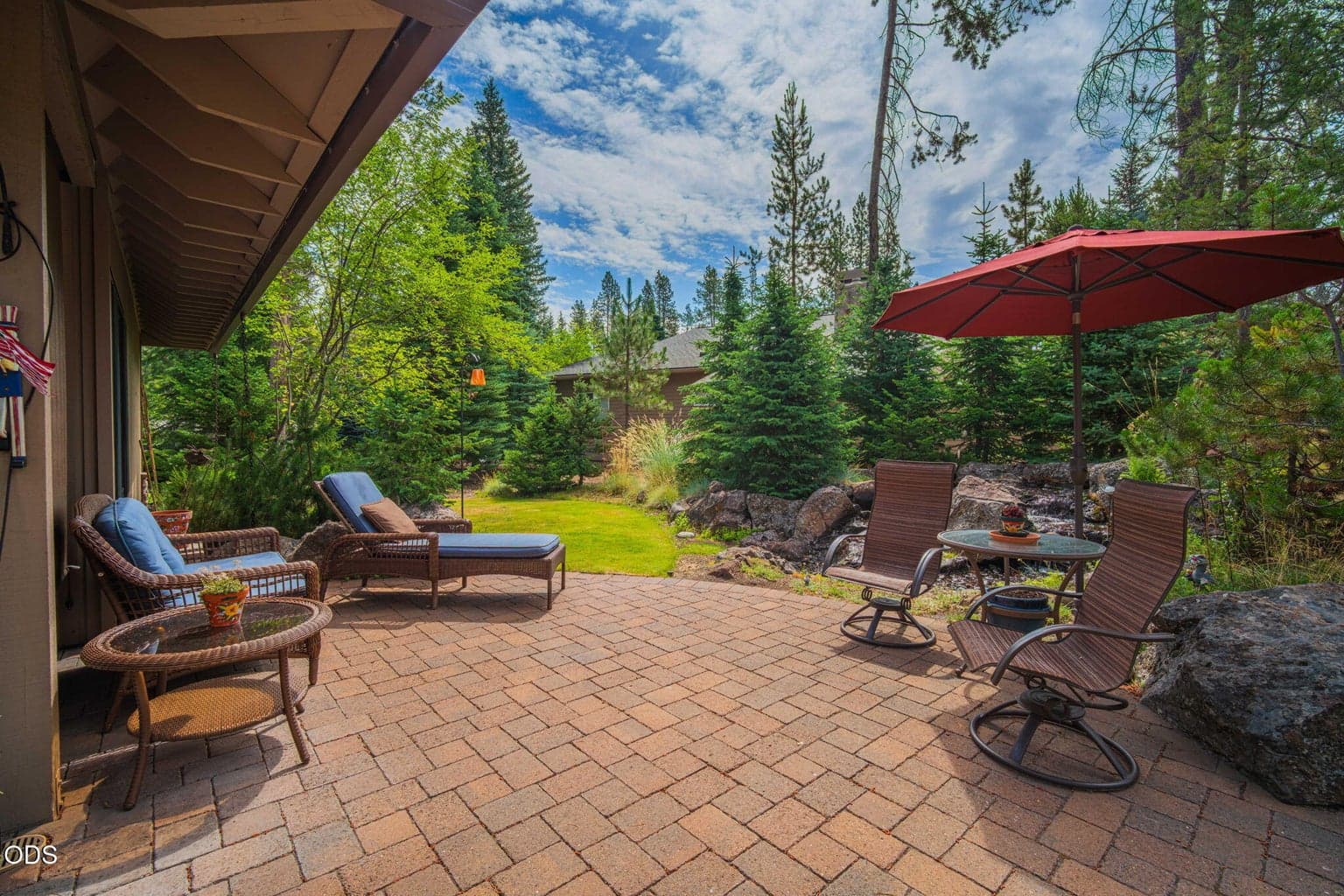 Secluded side yard oasis with curved pavers and the soothing sound of the water feature nearby.