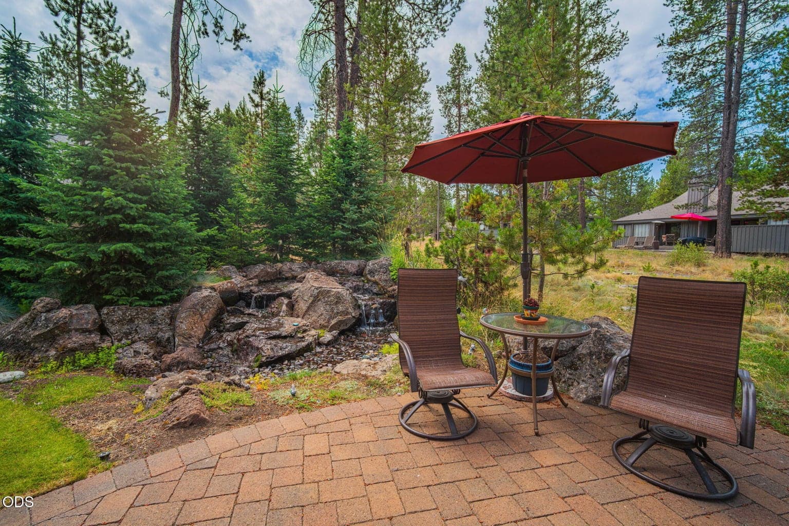 Gently arched patio right next to the pleasing sounds of the water feature - enjoy your private Sunriver retreat.