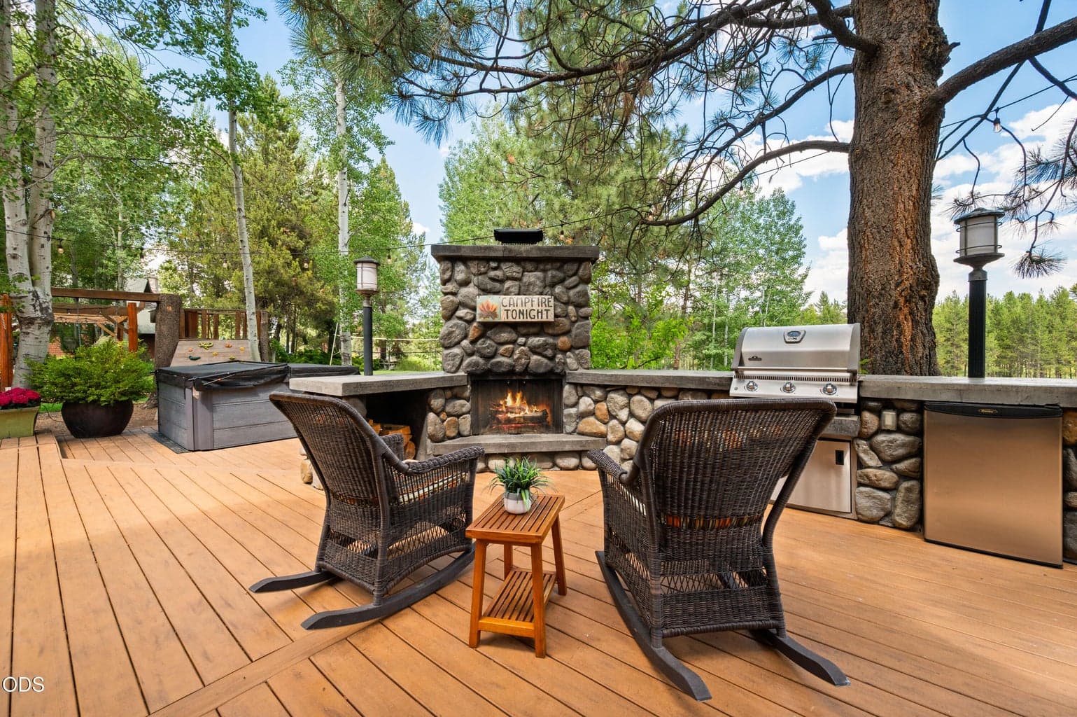 Complete with a river rock wood burning fireplace for the ultimate summer evening experience.