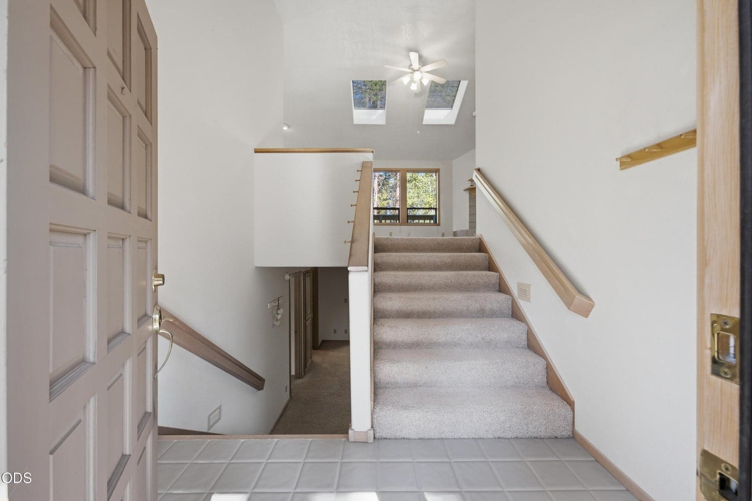 Entry to custom Split-level home w/1 Primary Bdrm/ensuite, Kitchen Living Rm & half-bath up & 2nd, 3rd Primary, ensuites, & 2nd living room downstairs w/laundry rm to garage, wine or tool storage room.