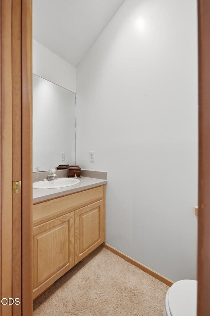 1/2 Bath/Powder Room w/Laundry Chute upstairs off the living room just outside of the 1st primary upstairs so guests have their main level access and those in the 1st Primary/ensuite have their privacy!