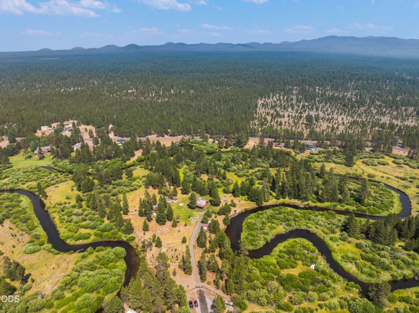 NW CUSTOM LOG HOME ON 22+ ACRES SURROUNDED BY THE LITTLE DESCHUTES RIVER!