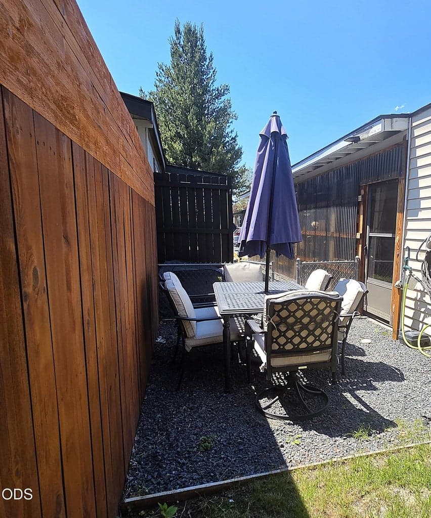 Access backyard from door in bonus space behind carport