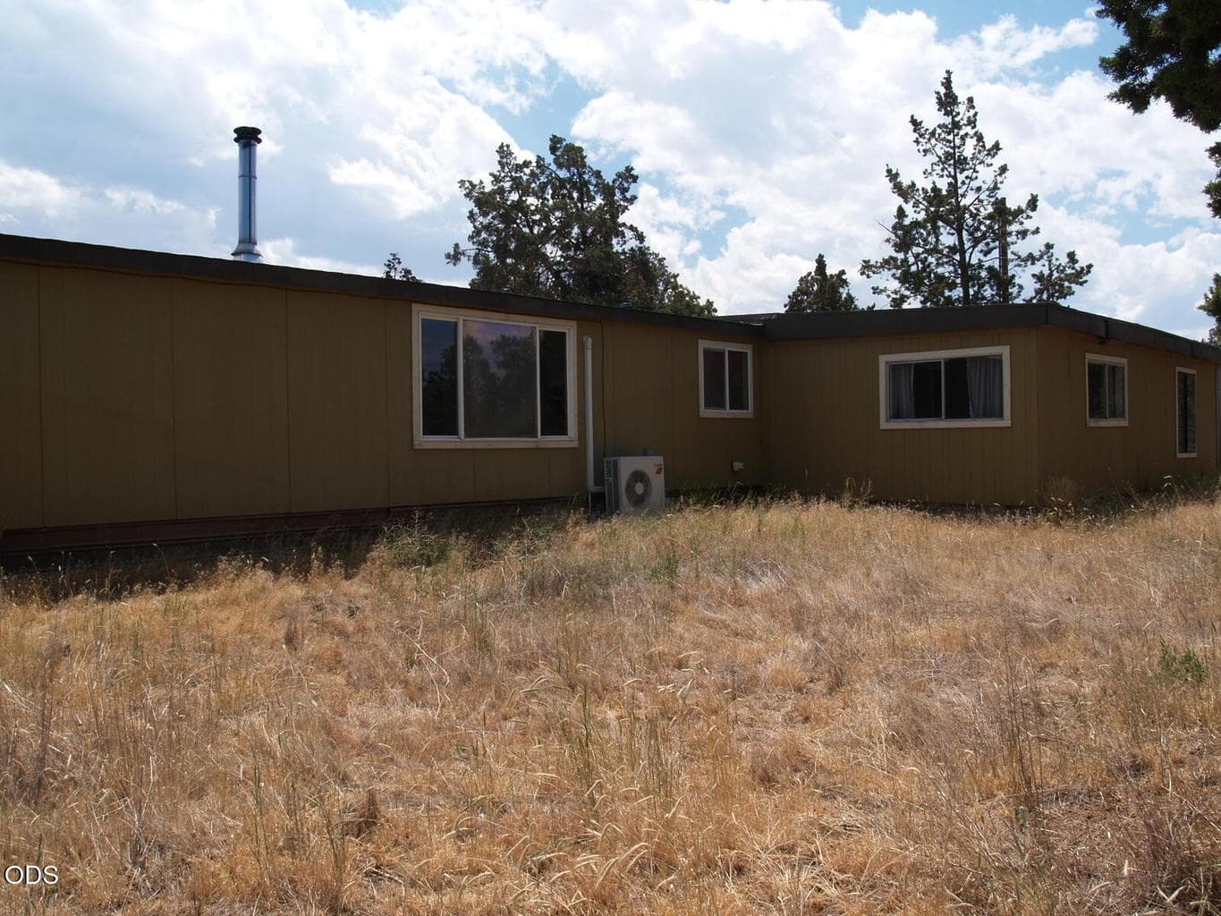 From west side of house looking southeast.