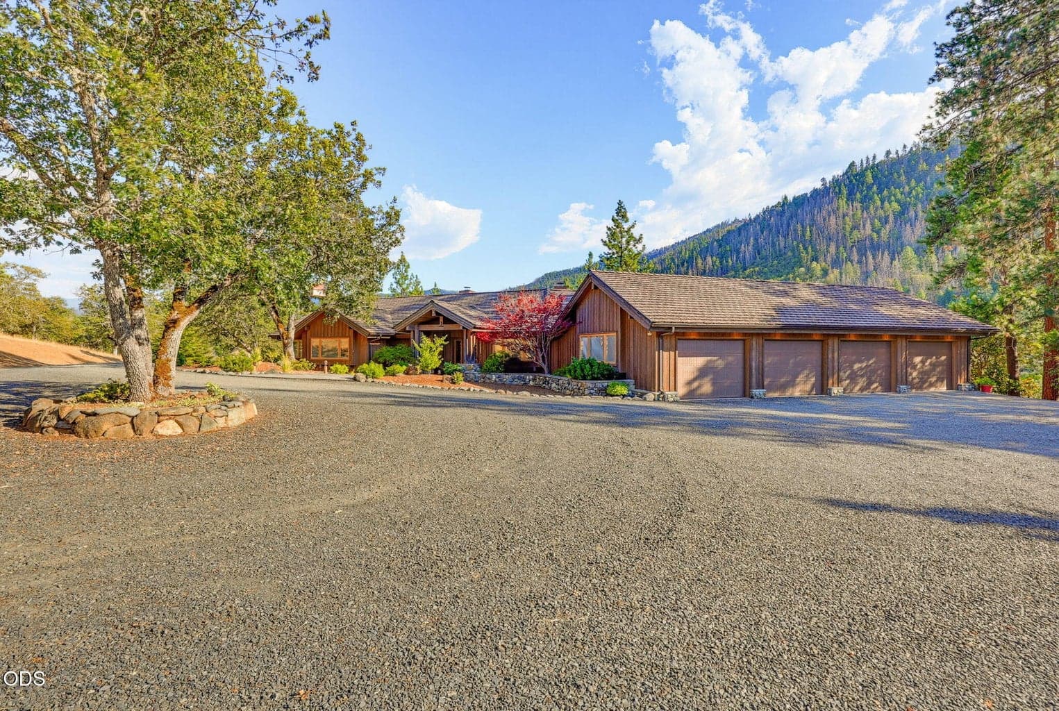 The house features a 4 car attached garage w/ amazing storage
