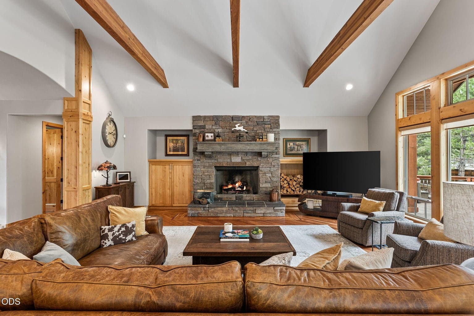 Grand fireplace viewed from the dining area.