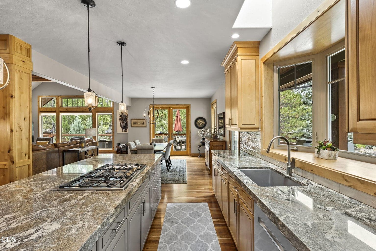Updated large composite single sink and fixtures add to kitchen convenience.
