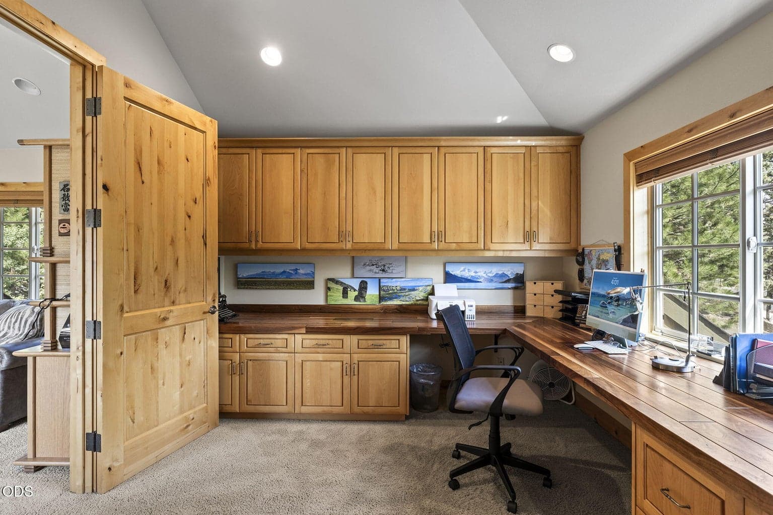 The office with built-in cabinetry and desk.