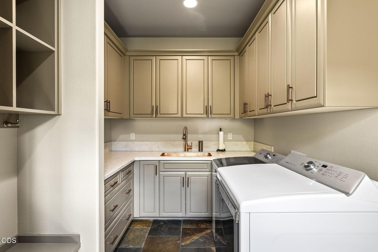 Laundry room updated with luxe lacquer paint finish.