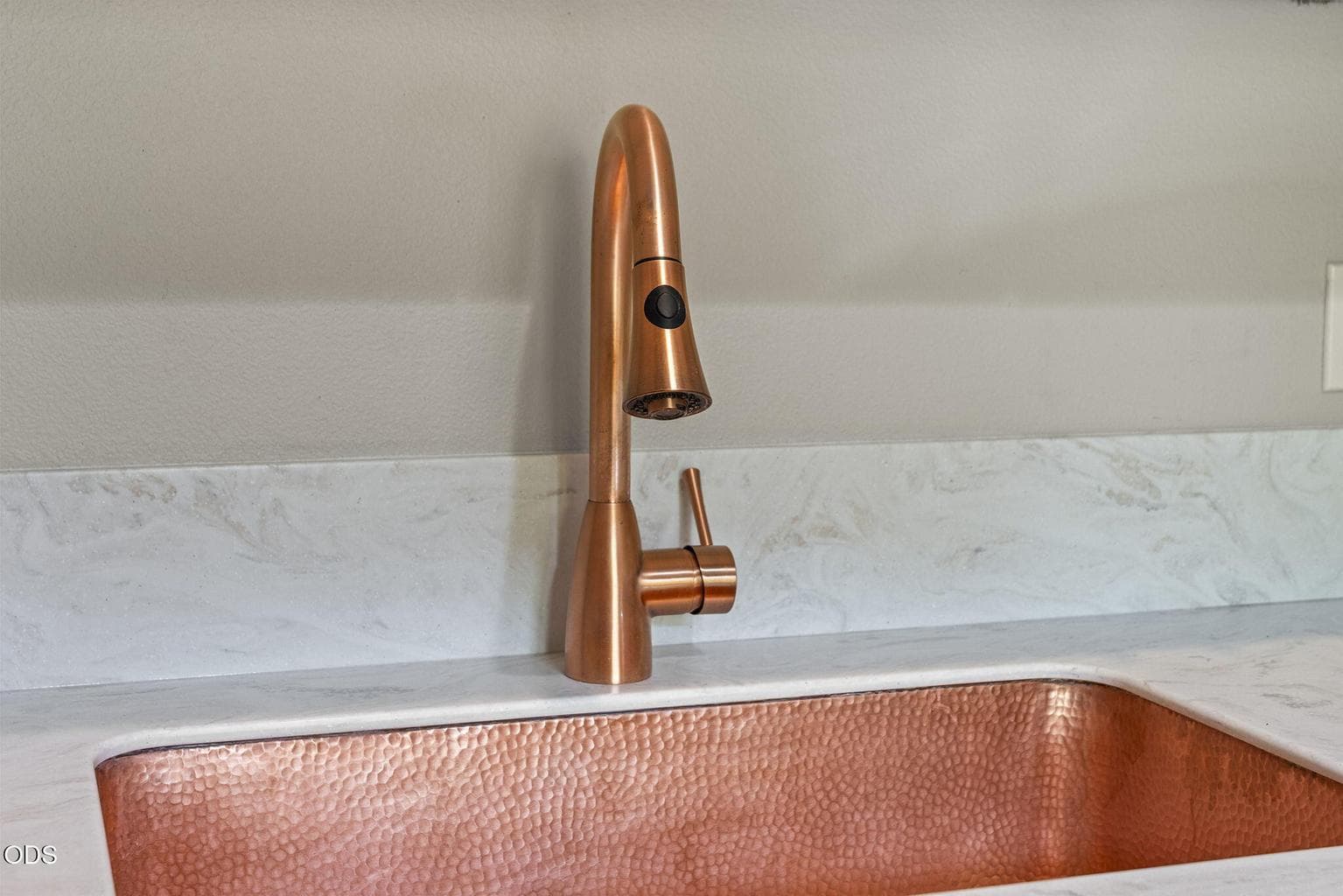 Laundry room update enhanced with owner's large copper laundry sink.