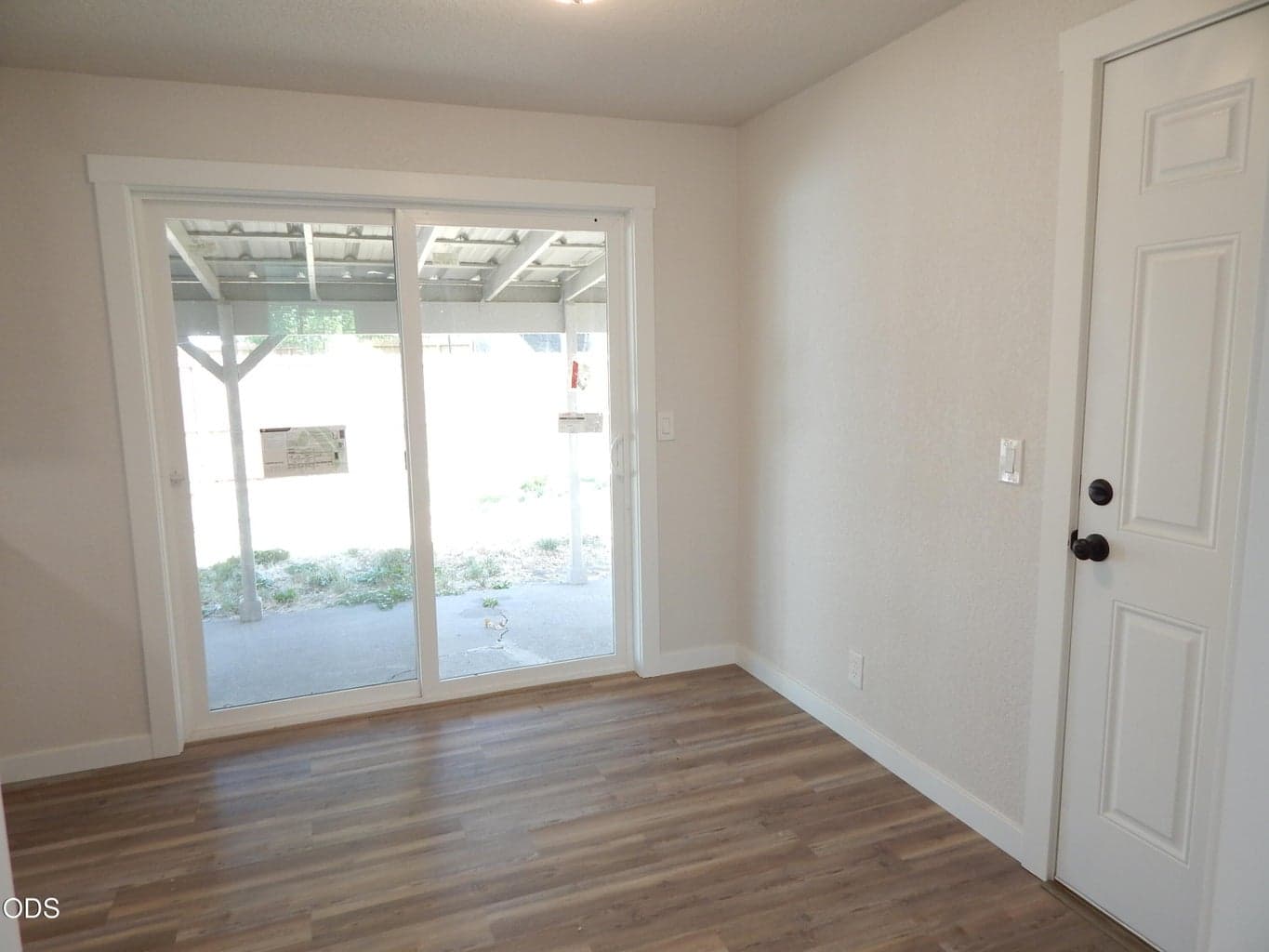 coming around front room to dining area. Door from garage to dining area